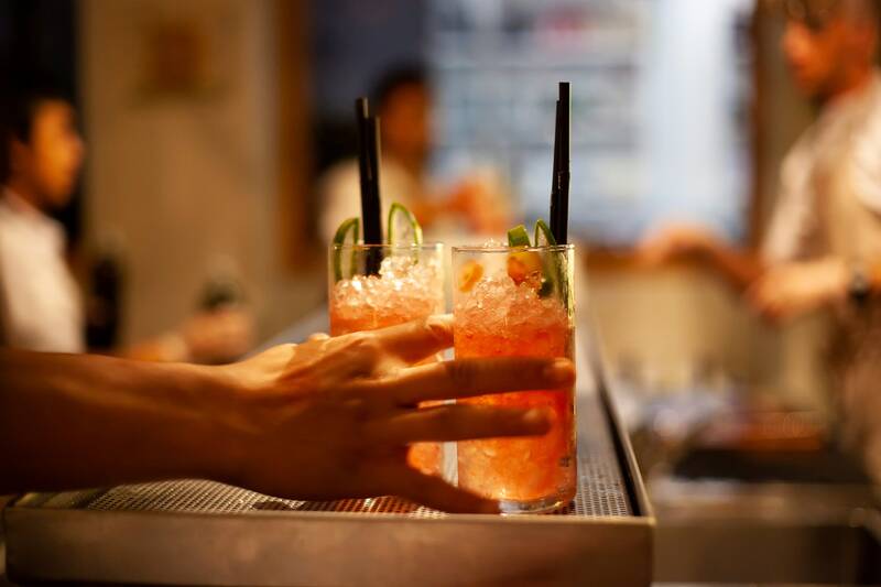 Refreshing drinks prepared by a mixologist and served in an upscale restaurant